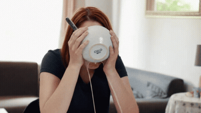 A Woman Holds A Bowl With Oslo Written On It GIF