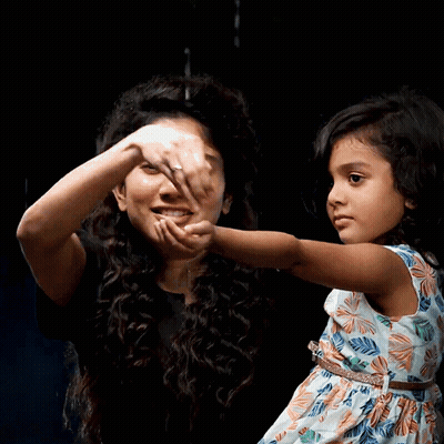 A Woman Holds A Little Girl 'S Hand And They Are Smiling GIF