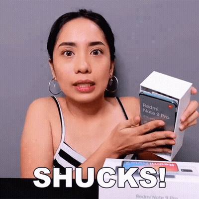 A Woman Holds A Redmi Note 9 Pro In Her Hands GIF