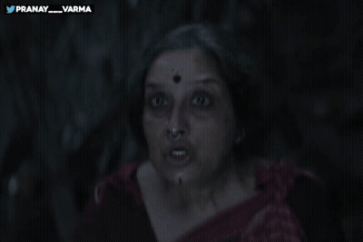 A Woman Holds Her Finger To Her Lips With The Words Pranay_varma Behind Her GIF