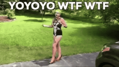 A Woman In A Bathing Suit Is Standing On A Sidewalk In Front Of A Grassy Yard . GIF