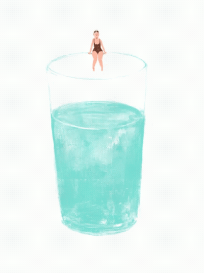 A Woman In A Bathing Suit Sits On The Edge Of A Glass Of Water GIF