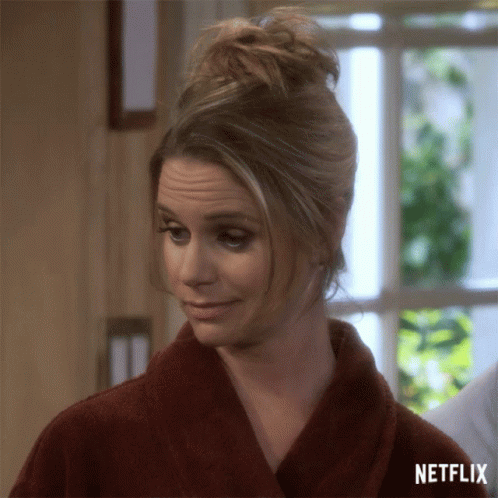 A Woman In A Bathrobe With The Word Netflix On The Bottom Right GIF
