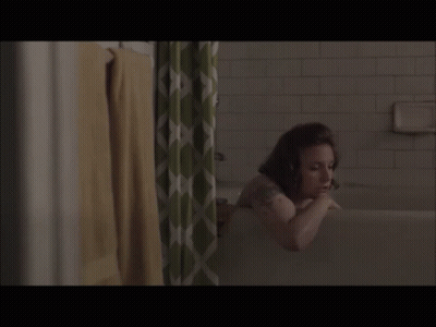A Woman In A Bathtub With A Shower Curtain GIF