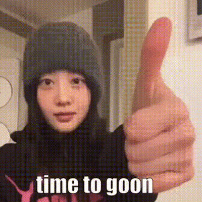 A Woman In A Beanie Is Giving A Thumbs Up . GIF