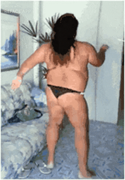 A Woman In A Bikini Is Dancing On A Bed GIF