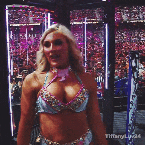 A Woman In A Bikini Is Standing In A Wrestling Ring With The Word Tiffany On The Bottom GIF
