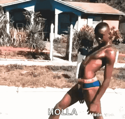 A Woman In A Bikini Is Walking Down A Street And The Word Holla Is On The Bottom Right GIF