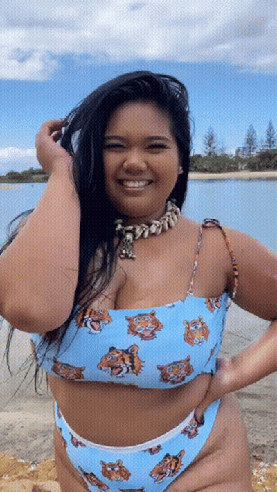 A Woman In A Bikini With Tigers On It GIF