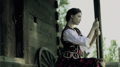 A Woman In A Black And White Dress Has The Number 8 On Her Waist GIF