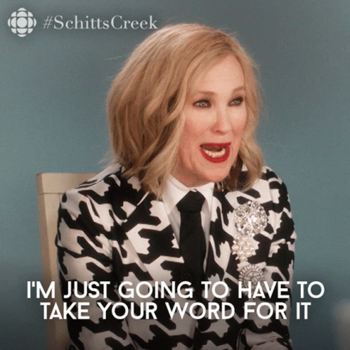 A Woman In A Black And White Suit And Tie Says I 'M Just Going To Have To Take Your Word For It GIF