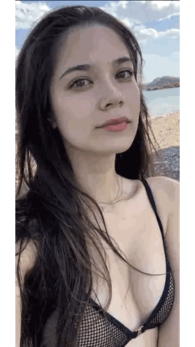 A Woman In A Black Bikini Is Taking A Selfie Sticker