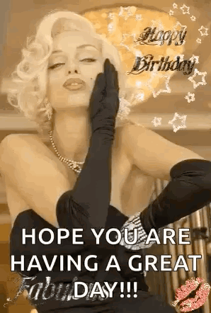 A Woman In A Black Dress And Gloves Is Blowing A Kiss On Her Face . GIF