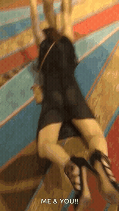 A Woman In A Black Dress And High Heels Is Laying On The Floor And Says Me & You ! GIF