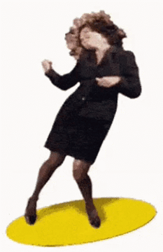 A Woman In A Black Dress Is Dancing On A Yellow Circle . GIF