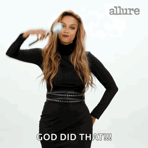 A Woman In A Black Dress Is Holding A Brush In Her Hand And Says God Did That GIF