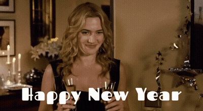 A Woman In A Black Dress Is Holding A Glass Of Champagne With The Words Happy New Year Written Below Her GIF