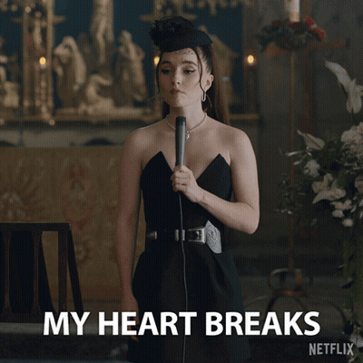 A Woman In A Black Dress Is Holding A Microphone And Says My Heart Breaks Netflix GIF