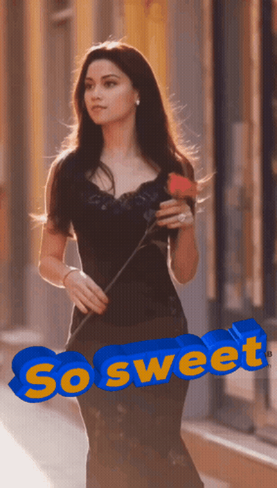 A Woman In A Black Dress Is Holding A Red Rose And The Word So Sweet Is Above Her GIF