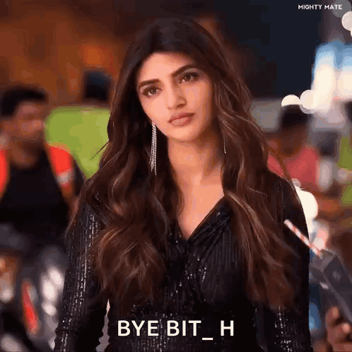 A Woman In A Black Dress Is Holding A Straw In Her Hand And Saying Bye Bit H . GIF