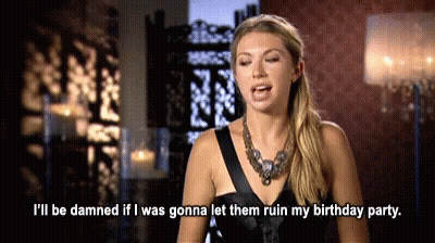 A Woman In A Black Dress Is Saying I 'Ll Be Damned If I Was Gonna Let Them Ruin My Birthday Party GIF