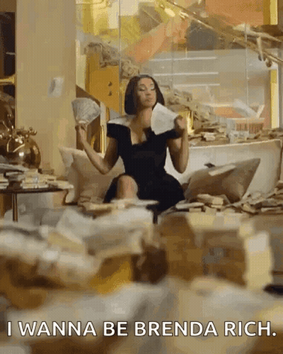 A Woman In A Black Dress Is Sitting On A Couch Holding A Fan Of Money And A Piece Of Paper . GIF