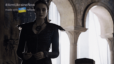 A Woman In A Black Dress Is Standing In A Room With Arches And The Words Armukrainenow Made With Reface GIF