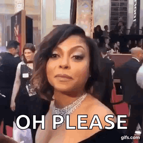 A Woman In A Black Dress Is Standing On A Red Carpet . GIF