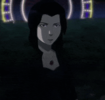 A Woman In A Black Dress Stands In Front Of A Sign That Says ' A ' GIF