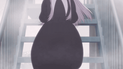 A Woman In A Black Dress Walking Down Stairs GIF
