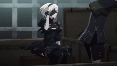 A Woman In A Black Dress With A Mask On Her Face GIF