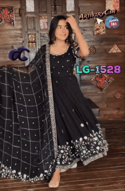 A Woman In A Black Dress With Lg-1528 Written On The Bottom GIF