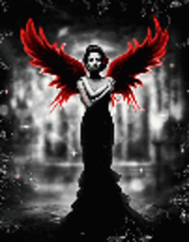 A Woman In A Black Dress With Red Wings Is Standing In The Dark GIF