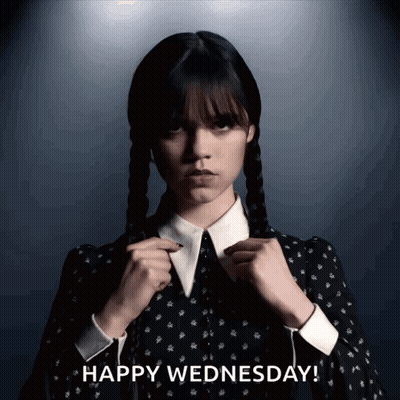 A Woman In A Black Dress With The Words Happy Wednesday Behind Her GIF