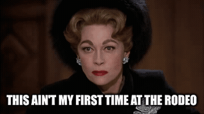 A Woman In A Black Hat Is Making A Funny Face And Saying `` This Ain T My First Time At The Rodeo '' GIF