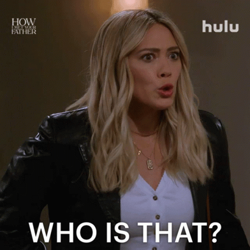 A Woman In A Black Jacket Is Asking Who Is That GIF