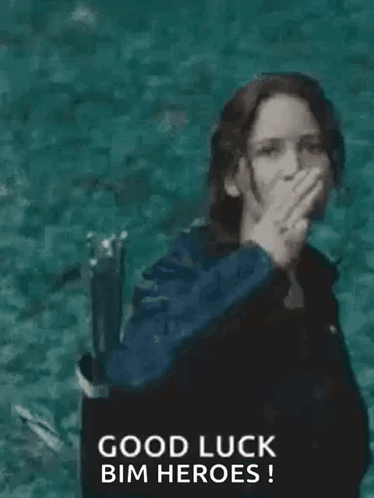 A Woman In A Black Jacket Is Giving The Middle Finger While Standing In The Water . GIF