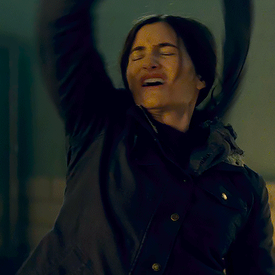 A Woman In A Black Jacket Is Making A Funny Face And The Caption Says Is It Hot GIF