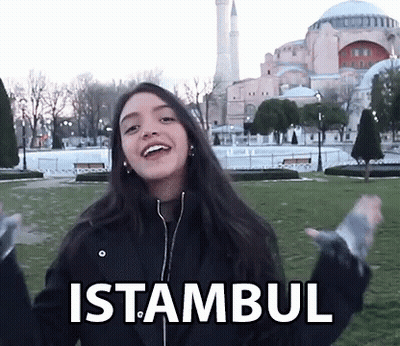 A Woman In A Black Jacket With The Word Istanbul On Her Jacket GIF