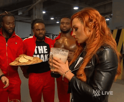 A Woman In A Black Leather Jacket Is Holding A Glass Of Milk And A Tray Of Pancakes GIF