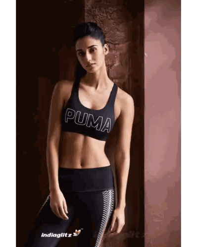 A Woman In A Black Puma Sports Bra And Leggings Sticker
