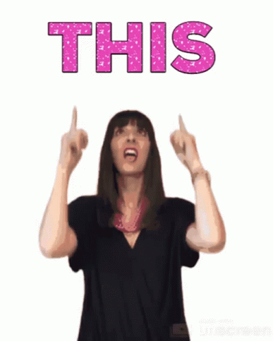 A Woman In A Black Shirt Is Pointing Up At The Word This In Pink Letters GIF