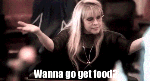 A Woman In A Black Shirt Is Saying Wanna Go Get Food ? GIF