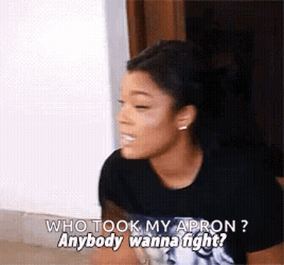 A Woman In A Black Shirt Is Talking To Another Woman . GIF
