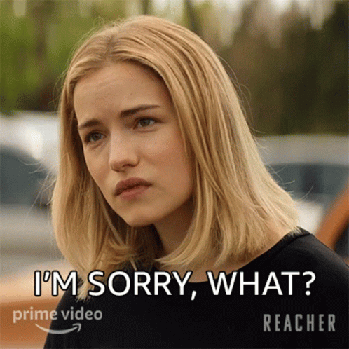 A Woman In A Black Shirt Says I 'M Sorry What In White Letters GIF