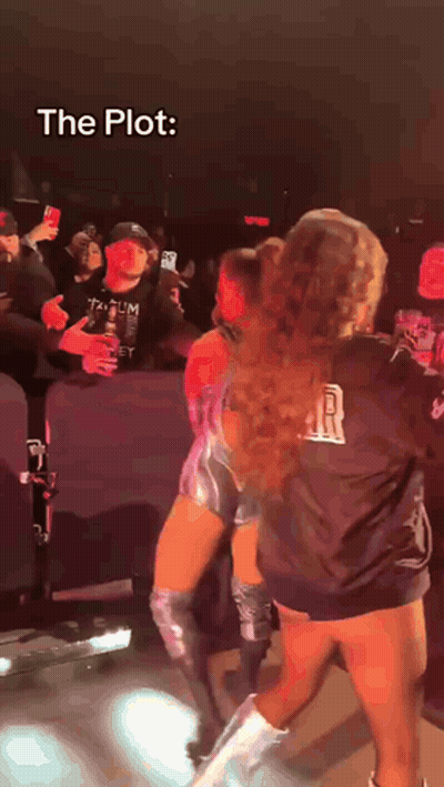 A Woman In A Black Shirt That Says R On It GIF
