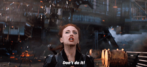 A Woman In A Black Suit Is Saying " Don T Do It " GIF