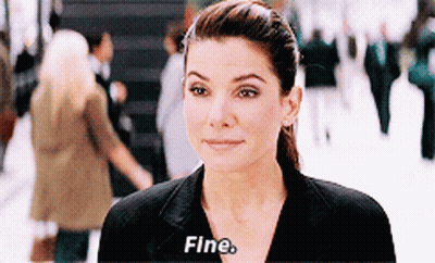A Woman In A Black Suit Says Fine GIF