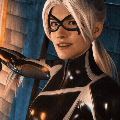 A Woman In A Black Superhero Costume With Glasses GIF