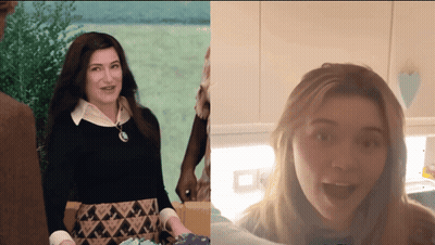 A Woman In A Black Sweater And A Woman In A White Shirt GIF